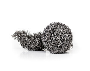Two steel wool scrubbers. New and used stainless steel wool scouring pads. Used to clean heavy duty dirt,  kitchen crease and oil. Isolated on white. Selective focus.