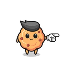 chocolate chip cookie mascot with pointing right gesture