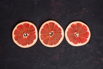 red grapefruit on a dark background