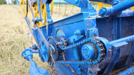 Chain with old sprockets. Close up dirty chains with grease that drives the combine harvester...