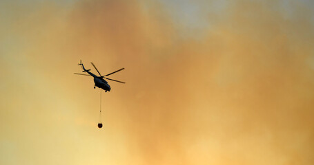 Russian helicopter draws water from the sea to extinguish a forest fire. Marmaris,Turkey