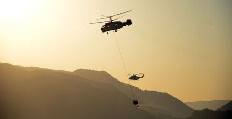 Russian helicopter draws water from the sea to extinguish a forest fire. Marmaris,Turkey