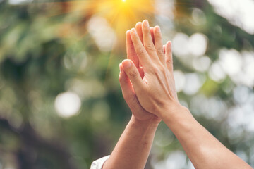 Teamwork high five as team together hands raise up greeting power tag teams. Diversity multiethnic two people success unity togetherness in Volunteer community. Collaborate Business partner win teams