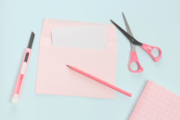 flat lay pink letter and stationery