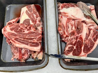 Fresh lamb shoulder at a butcher place