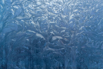 Beautiful drawing of frost on the glass of the car.