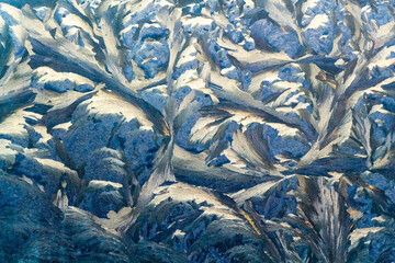 Beautiful drawing of frost on the glass of the car.