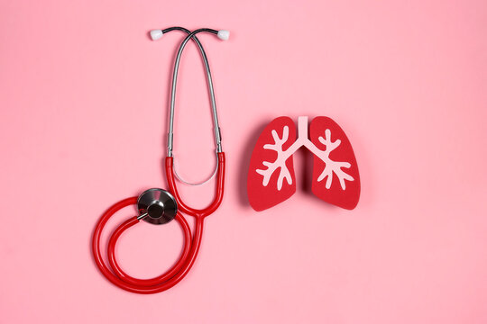 Prevention of pulmonary disease. Lung symbol and red stethoscope on a pink background. Healthcare and