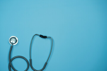 Closeup Stethoscope on pastel blue background with copy space, Health concept.