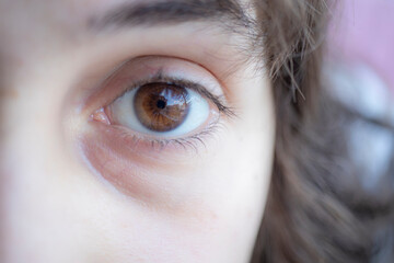 brown pupil, girl's eye close-up