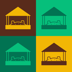 Naklejka premium Pop art Sandbox for kids with sand and umbrella icon isolated on color background. Vector