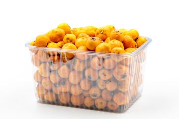 Packed yellow hawthorn on a white background. In combination with a ripe yellow hawthorn shade. close up