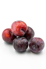 Black plum on a white background. Combined with a mature black plum shade. Story format close-up