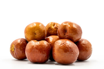 Obraz premium Jujube on a white background. Combined with a ripe jujube shade. Close up