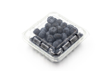Packed blueberries on a white background. In combination with the shade of ripe blueberries. close up
