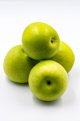 Sour apples on a white background. Ripe Green combined with a shade of sour apple. Story format close-up