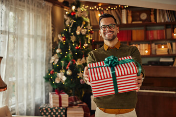 Smiling man with Christmas gift
