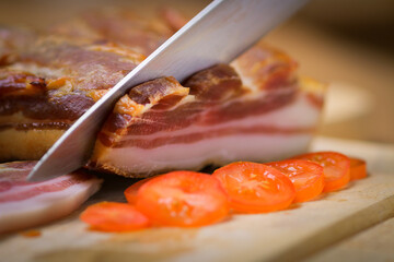 Delicious healthy breakfast with bacon, tomato, serving in the k