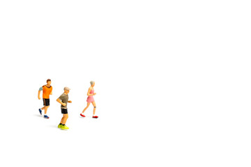 Miniature people running on white background , Healthy lifestyle and sport concepts.