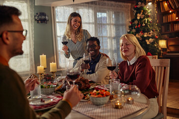 Diverse friends at Christmas party. Celebrating holiday together