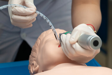 Anesthesiologist performing an orotracheal intubation on a simulation, Medical manipulation....