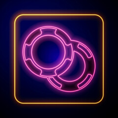 Glowing neon Casino chips icon isolated on black background. Casino gambling. Vector