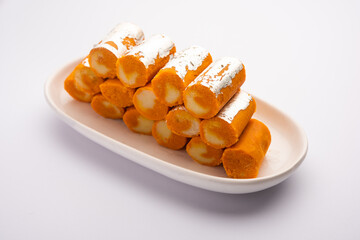 Orange Roll barfee or barfi sweet or Mitlai