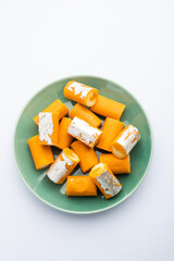 Orange Roll barfee or barfi sweet or Mitlai