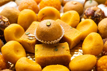 Naklejka na ściany i meble Group of Indian assorted sweets or mithai with diya