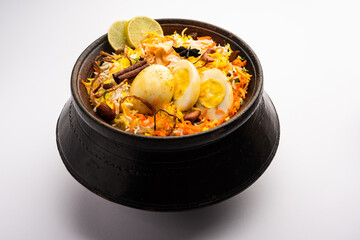 Anda biryani or egg biryani served in handi or plate