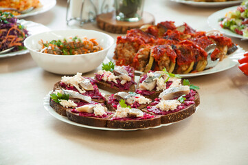 sandwiches with  fish. delicious food on a plate. quick snack on the table	