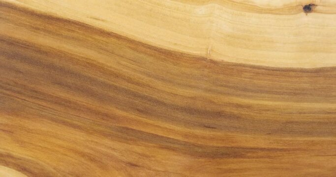 Rotation of a natural apple tree board. Apple tree background and wood texture