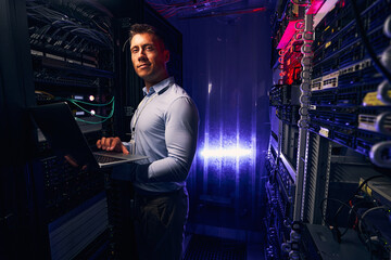 System administrator testing equipment in data center