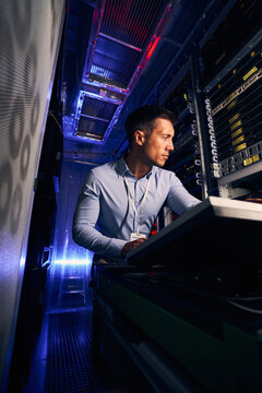Experienced IT professional setting up computer equipment
