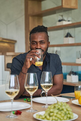 Young man looking at camera with interest