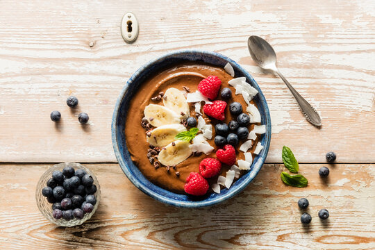 Bowl of chocolate butter with fruits