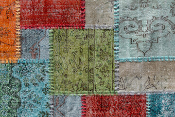 Detail of old asian patchwork carpet background and texture