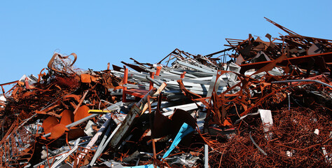 pile of rusted ferrous scrap in a landfill by a foundry