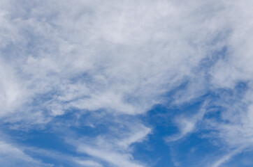 fluffy cloud and deep blue sky background