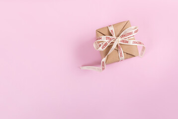 Christmas gift on pink background