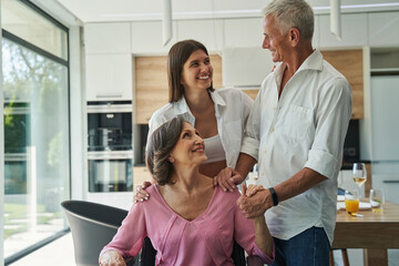 Man talking with young woman in kitchen