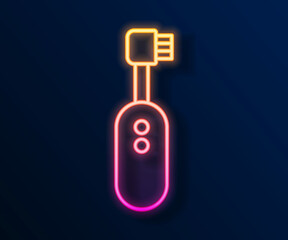 Glowing neon line Electric toothbrush icon isolated on black background. Vector
