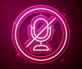 Glowing neon line Mute microphone icon isolated on red background. Microphone audio muted. Vector