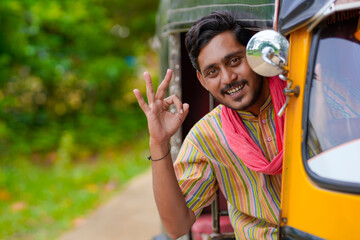 Indian auto rickshaw three-wheeler tuk-tuk taxi driver man