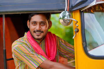 Indian auto rickshaw three-wheeler tuk-tuk taxi driver man