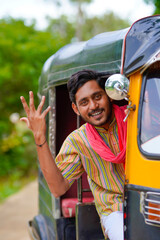 Indian auto rickshaw three-wheeler tuk-tuk taxi driver man