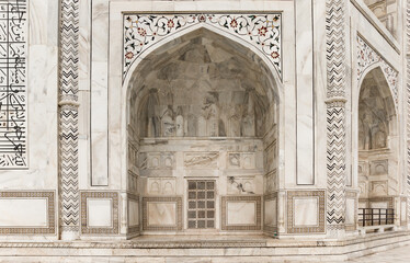 Decorated marble arch of the Taj Mahal monument in Agra, India