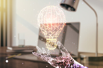 Obraz na płótnie Canvas Creative idea concept with light bulb illustration on modern laptop background. Multiexposure
