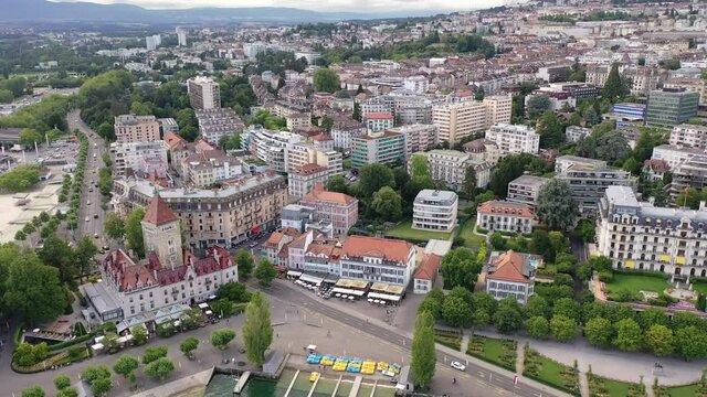 View from Lake Leman of residential areas of Swiss city of Lausanne in cloudy summer day, canton of Vaud in Romandy 