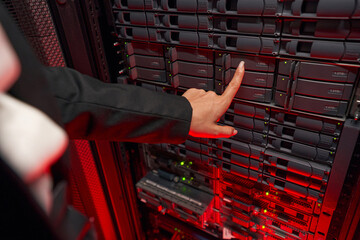 Woman system administrator maintain servers in data center